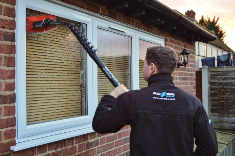 Callum cleaning window